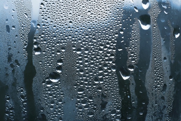 condensation on surface depicting water on oil tank