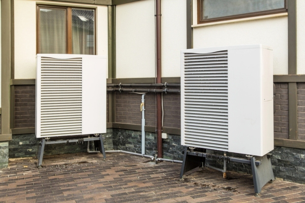 images of heat pumps mounted near the house depicting selecting the optimal heat pump