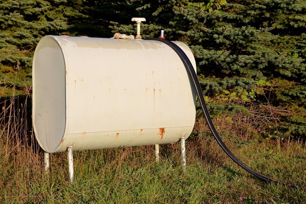 rusty old heating oil tank that requires a home heating oil storage tank replacement